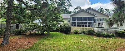 Screened porch from the yard before the renovation, Pinehurst NC