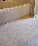 Primary bath tub and floor before the renovation, Pinehurst NC